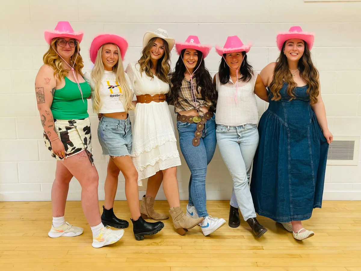 Hen party group dancing in rows during a private class